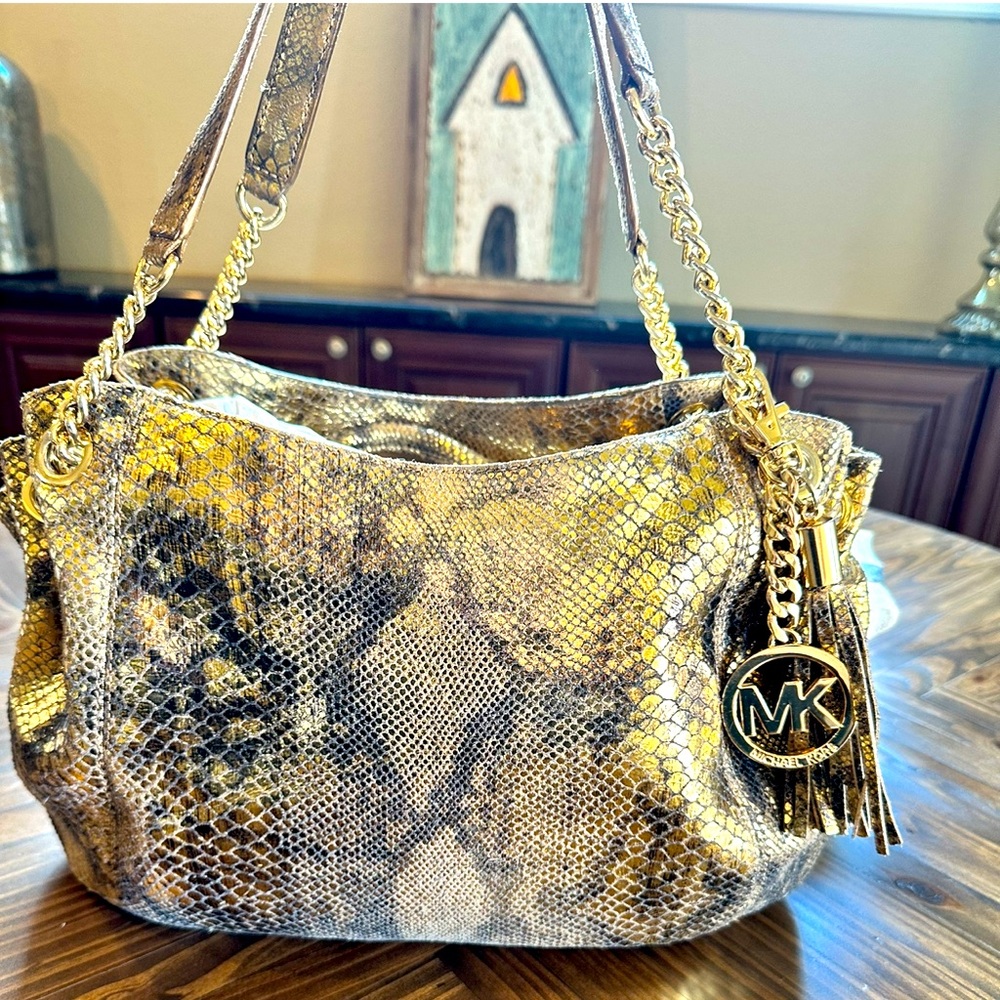 Michael Kors Gold Snake  Leather Handbag.
It is in excellent condition